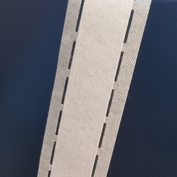 Entretela Banda Perfurada Reforçada com Cola